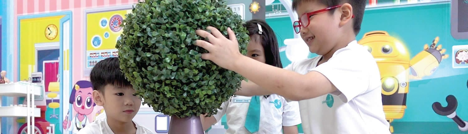 Children exploring robotics and AI in classroom activities