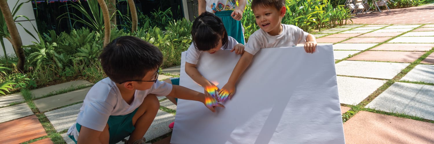 Children exploring light and colors in a hands-on experiment