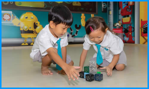 Nursery 2 children using coding cards to learn sequencing